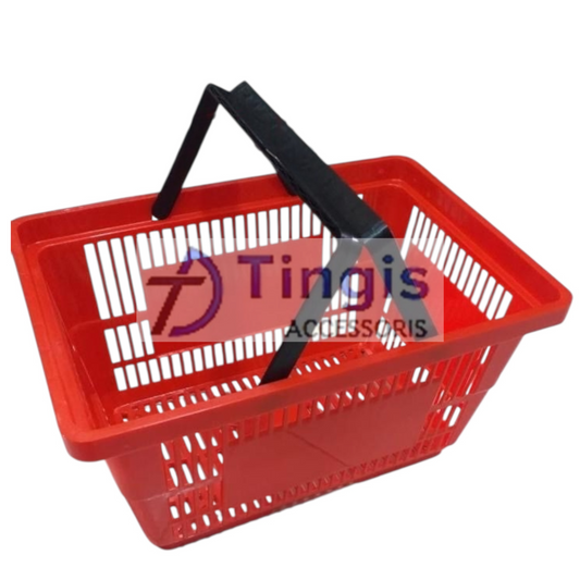 A bright red plastic shopping basket with a sturdy black handle, seen from above, ready for your shopping trip